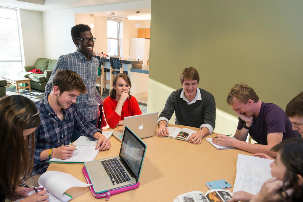 Mason students studying together in a residence hall lounge.
