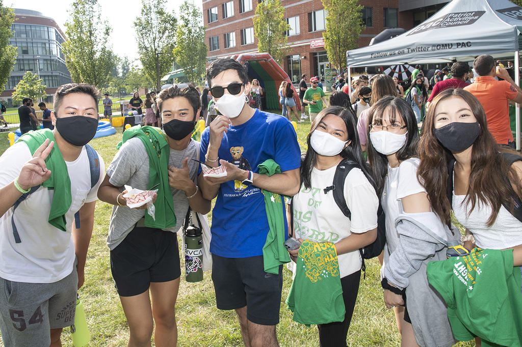 group of masked students outside