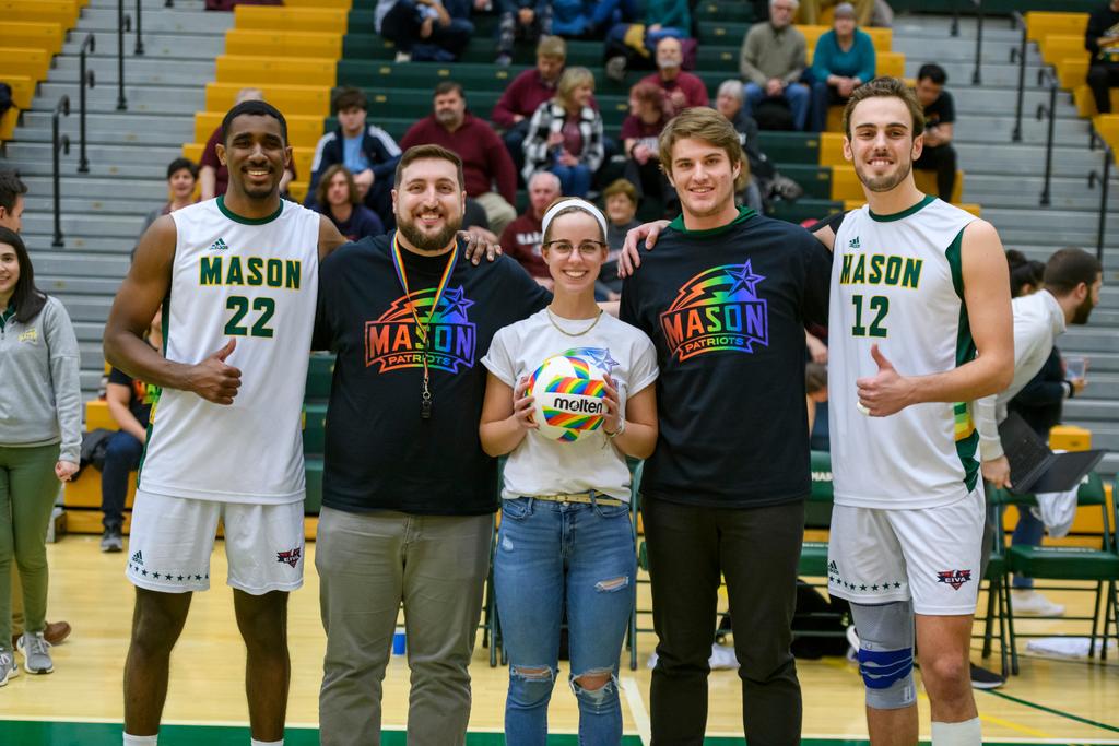 basketball players posing with members of the lgbtq community